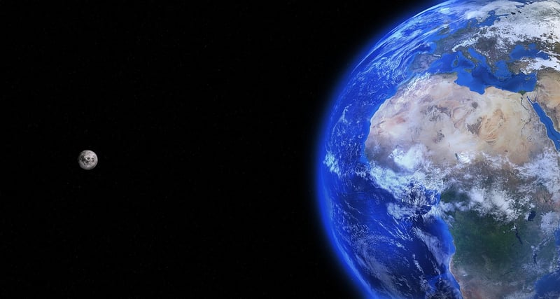 People holding hands around Earth